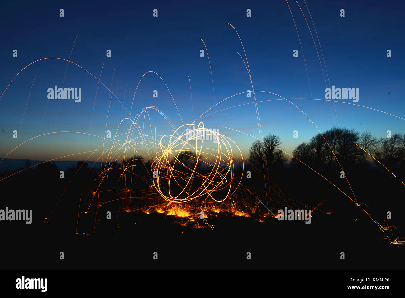 Steel wool photography. Light trails created by sparks during a long