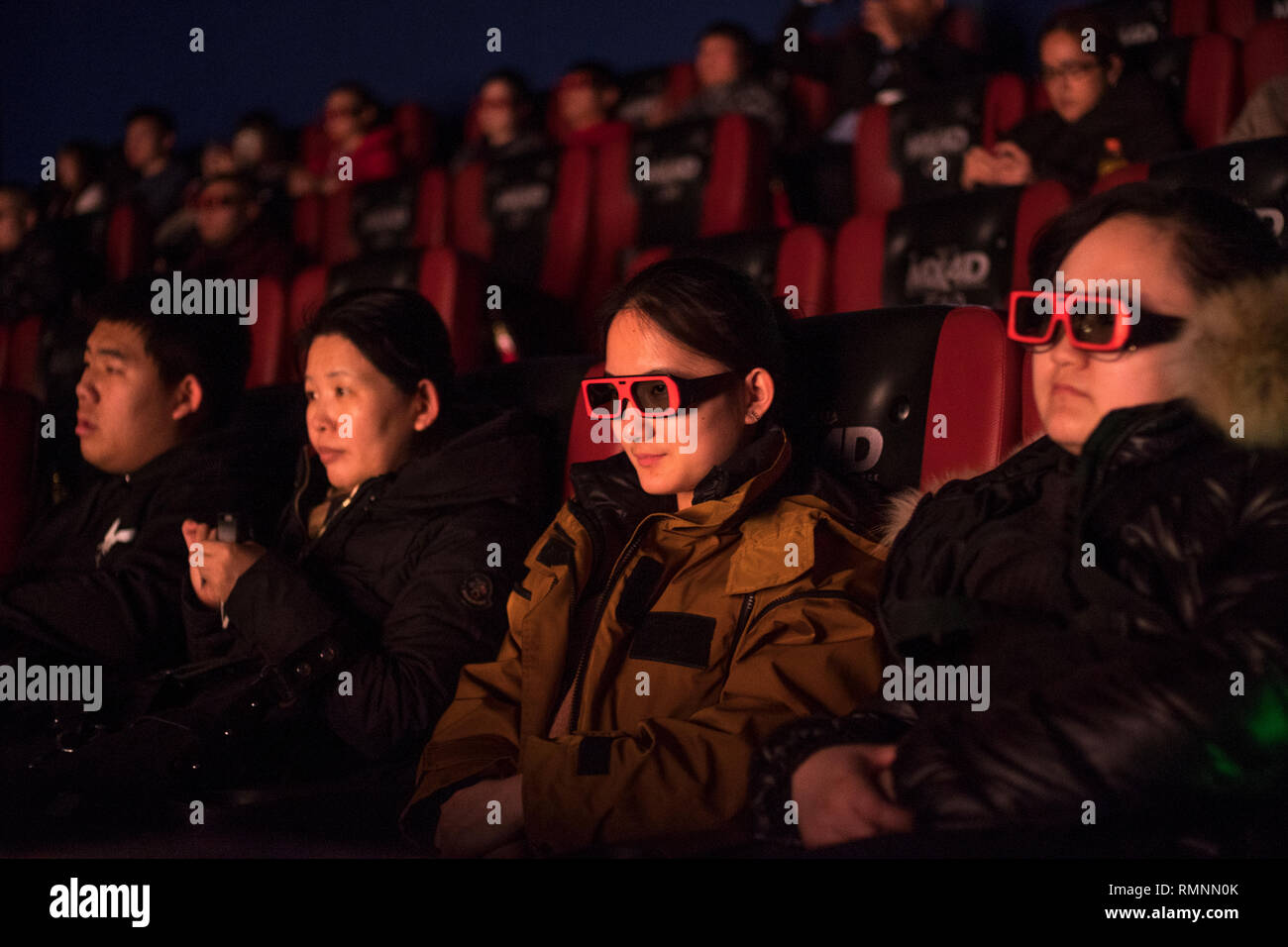 Audience watch “The Wandering Earth,” a Chinese sci-fi blockbuster in a theater in Beijing, China. 14-Feb-2019 Stock Photo