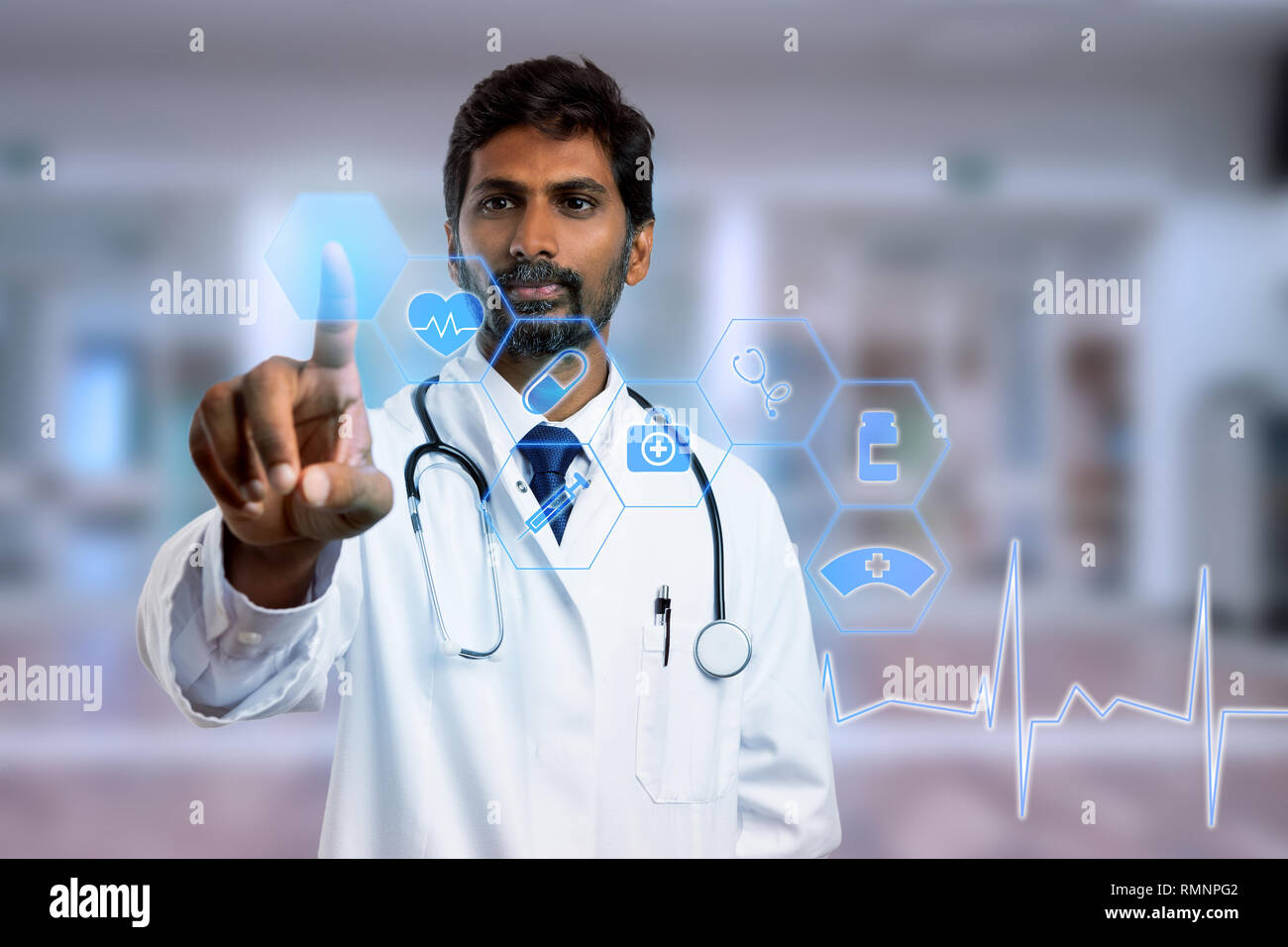 Indian doctor touching with index finger blue hexagon button on transparent screen as futuristic concept Stock Photo