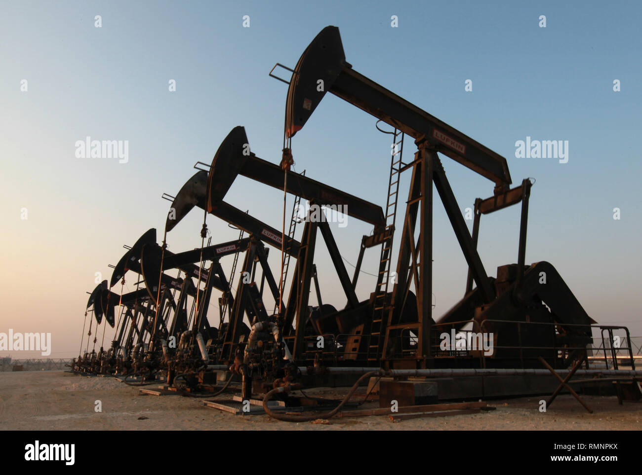 Oil pumps work in the desert oil fields of Sakhir, Bahrain. (Photo