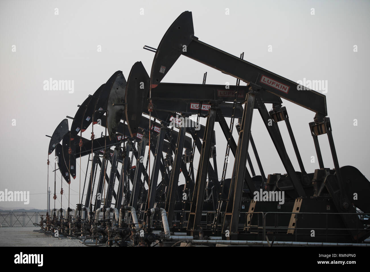 Oil pumps work in the desert oil fields of Sakhir, Bahrain. (Photo