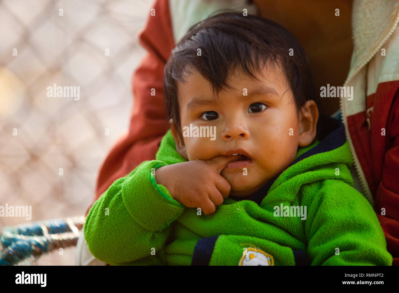 Little baby in the fish market of Ika Stock Photo - Alamy