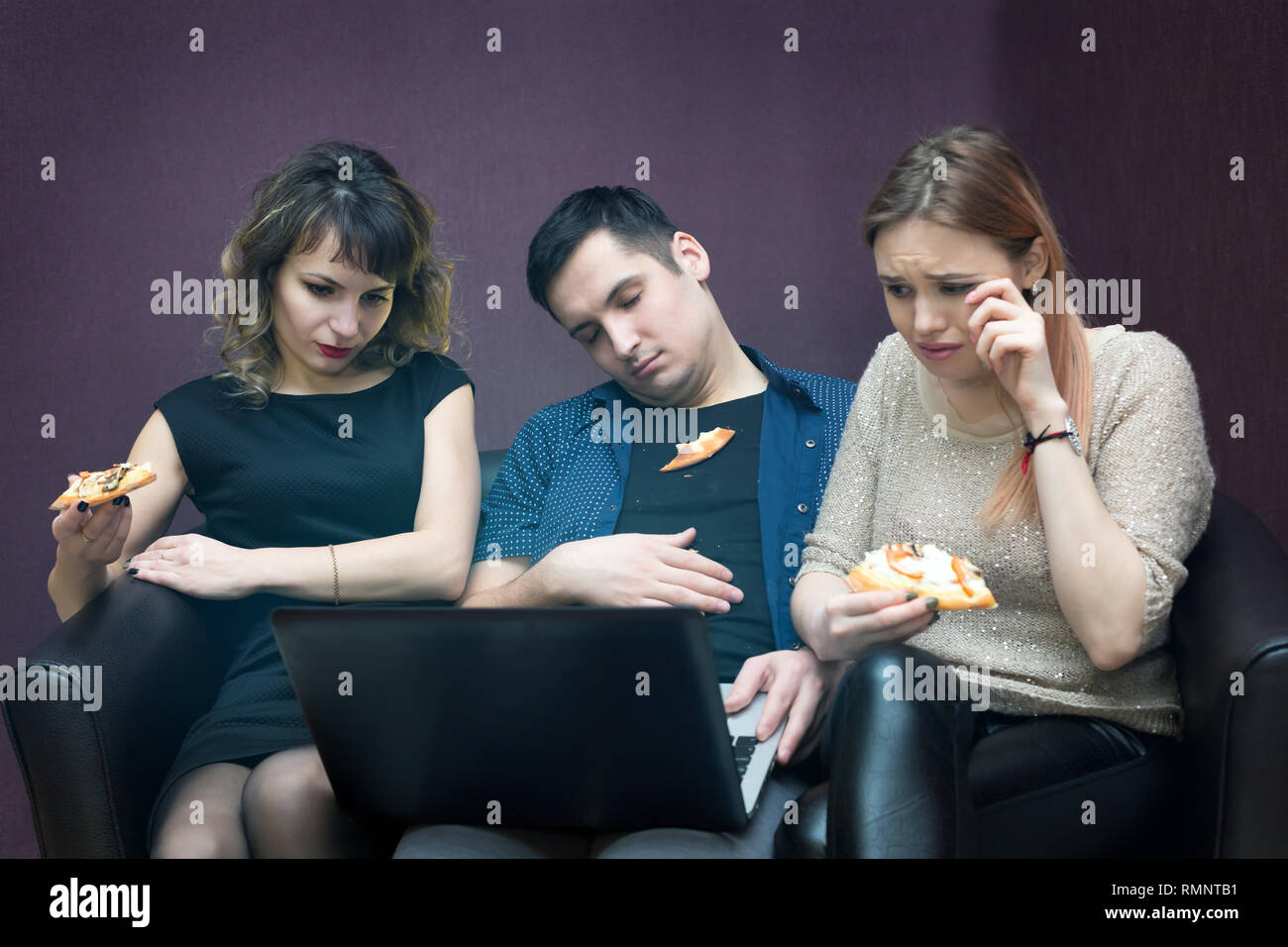 The girls watch a television series and the man fell asleep from boredom. Stock Photo