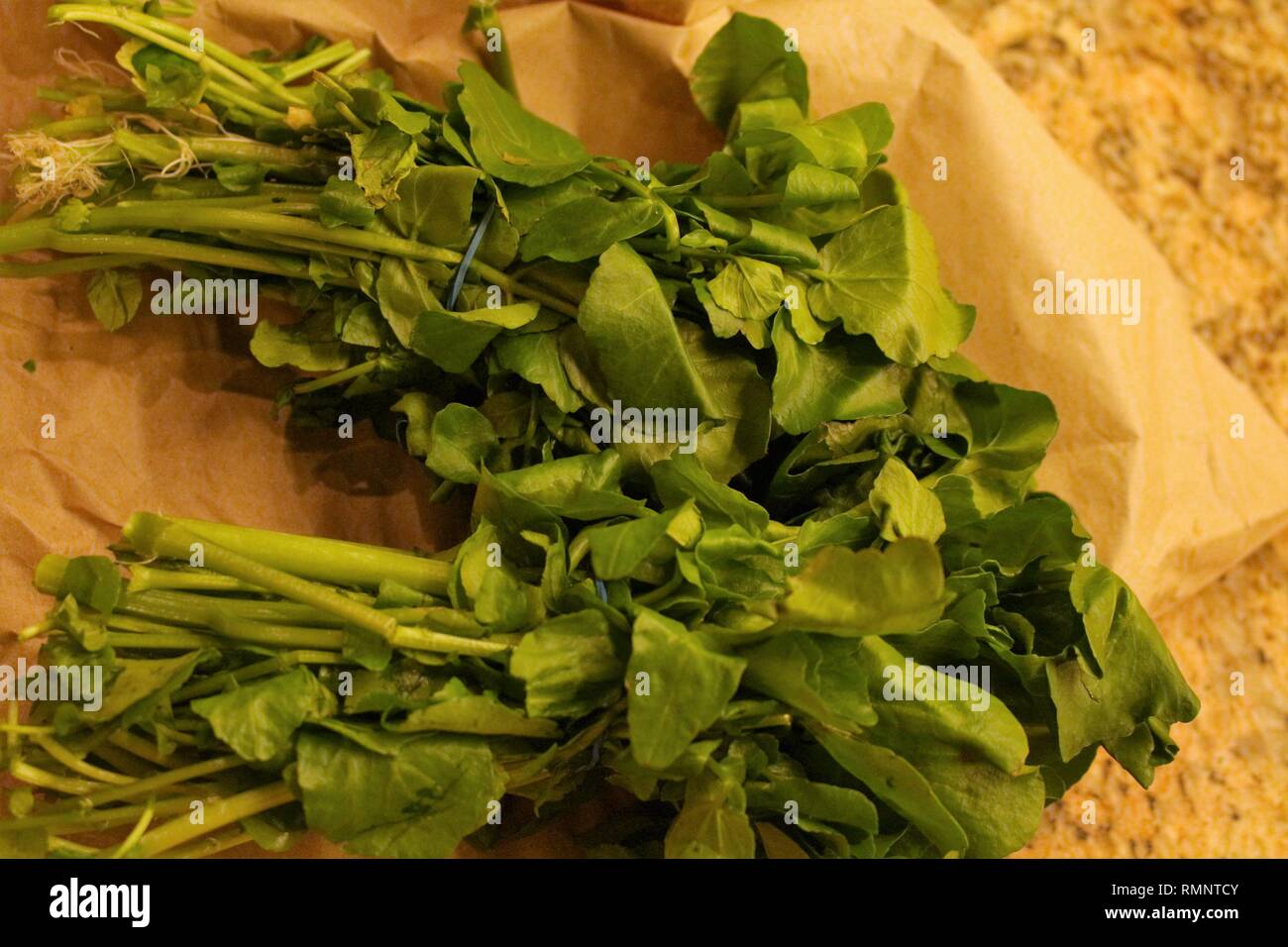 Watercress bundle on kitchen surface Stock Photo