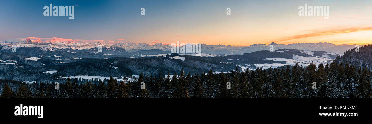 winter sunset panorama of the Bernese Alps including Eiger Mönch Jungfrau, Niesen and Stockhorn Stock Photo