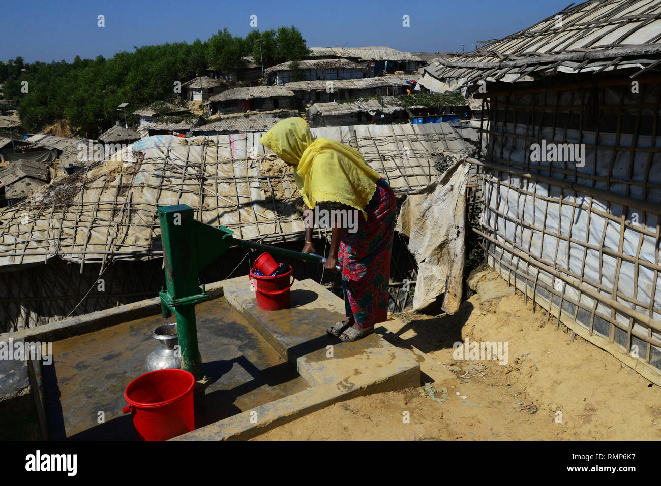 Rohingya refugee people collects water from the tube well in the ...