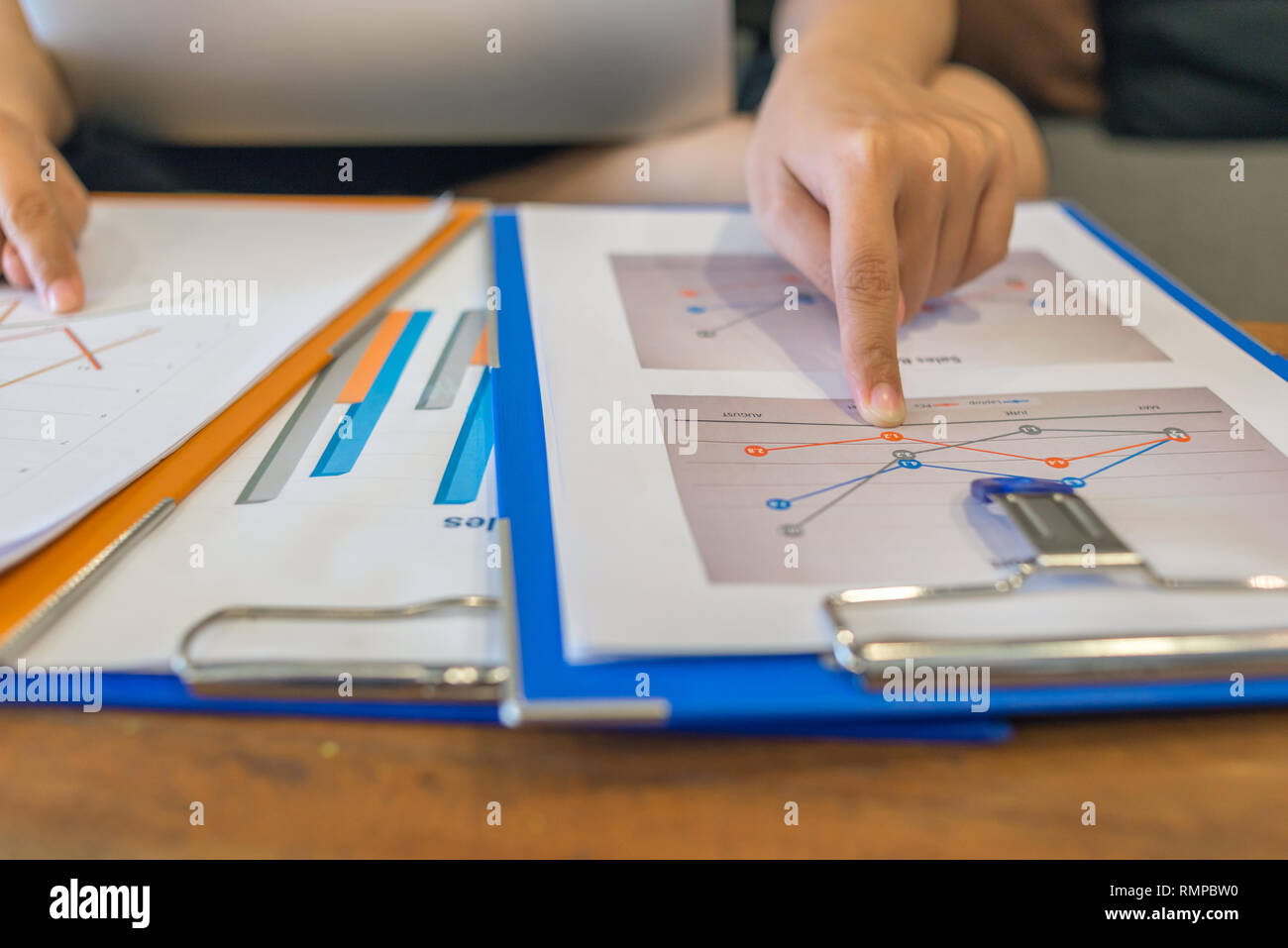 Compaing Paperwork Young businesswoman comparing financial documents at the office Stock ...