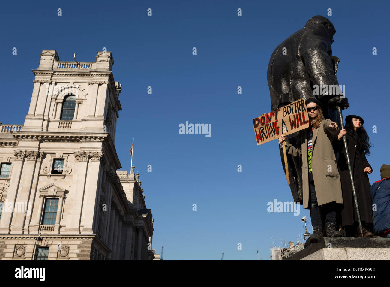 London, UK. 15th Feb, 2019.  Inspired by Swedish teenager Greta Thunberg and organised by Youth Strike 4 Climate, British eco-aware school and college-age pupils protest about Climate Change stand on the statue of Winston Churchill in Parliament Square during their walkout from classes, on 15th February 2019, in Westminster, London England. Photo by Richard Baker / Alamy Live News Credit: RichardBaker/Alamy Live News Stock Photo
