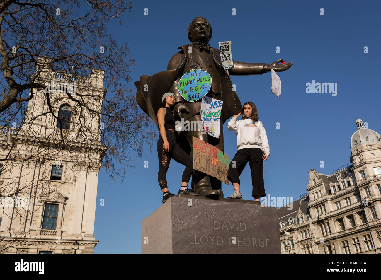 London, UK. 15th Feb, 2019.  Inspired by Swedish teenager Greta Thunberg and organised by Youth Strike 4 Climate, British eco-aware school and college-age pupils protest about Climate Change stand on the statue of Winston Churchill in Parliament Square during their walkout from classes, on 15th February 2019, in Westminster, London England. Photo by Richard Baker / Alamy Live News Credit: RichardBaker/Alamy Live News Stock Photo