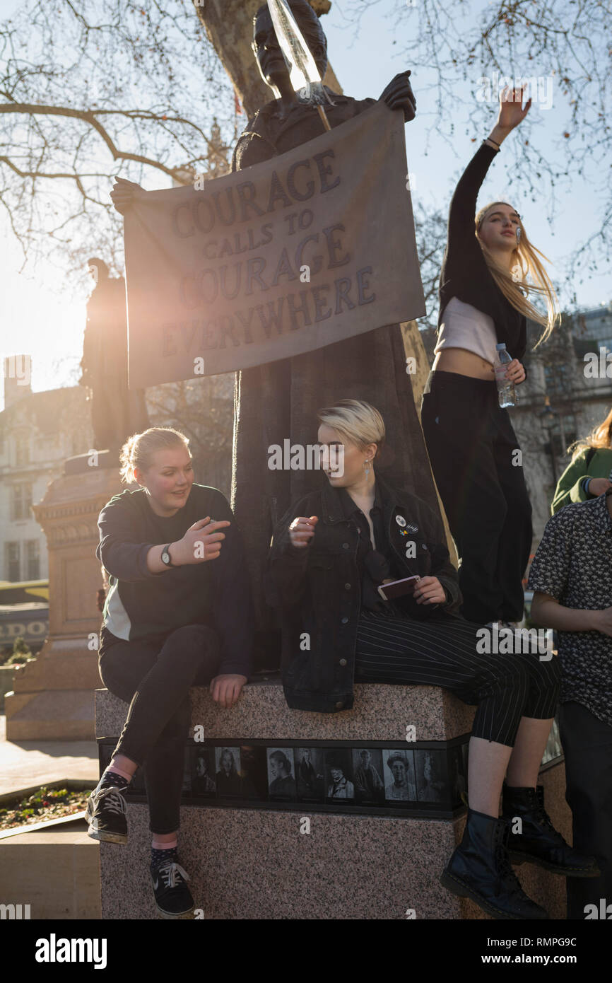 London, UK. 15th Feb, 2019.  Inspired by Swedish teenager Greta Thunberg and organised by Youth Strike 4 Climate, British eco-aware school and college-age pupils protest about Climate Change at the Suffragist Millicent Garrett Fawcett in Parliament Square during their walkout from classes, on 15th February 2019, in Westminster, London England. Photo by Richard Baker / Alamy Live News Credit: RichardBaker/Alamy Live News Stock Photo