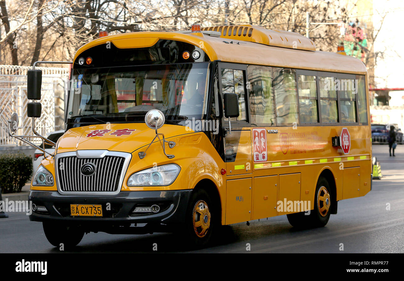 Beijing, China. 5th Feb, 2018. A yellow school bus arrives at an upscale housing area to pickup both foreign and Chinese students in Beijing on February 5, 2018. China is gradually adopting both American and European approaches in both culture and education. Credit: Todd Lee/ZUMA Wire/ZUMAPRESS.com/Alamy Live News Stock Photo