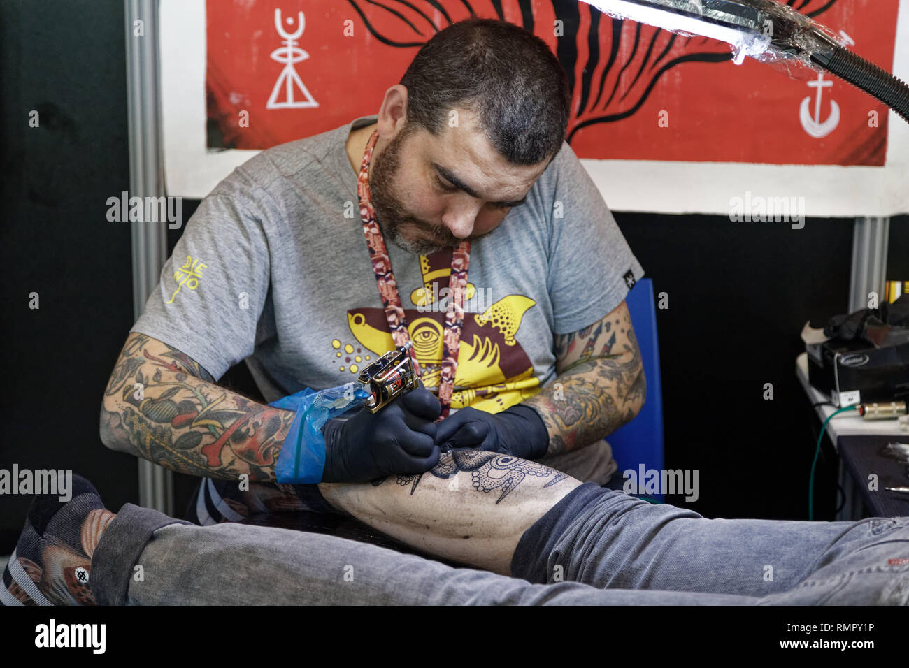 Paris, France. 15th Feb, 2019. Tattoo artist, Deno during the 9th edition of the Mondial du Tatouage (World Tattoo) on February 15, 2019 at the Grande Halle de la Villette in Paris, France. Credit: Bernard Menigault/Alamy Live News Stock Photo
