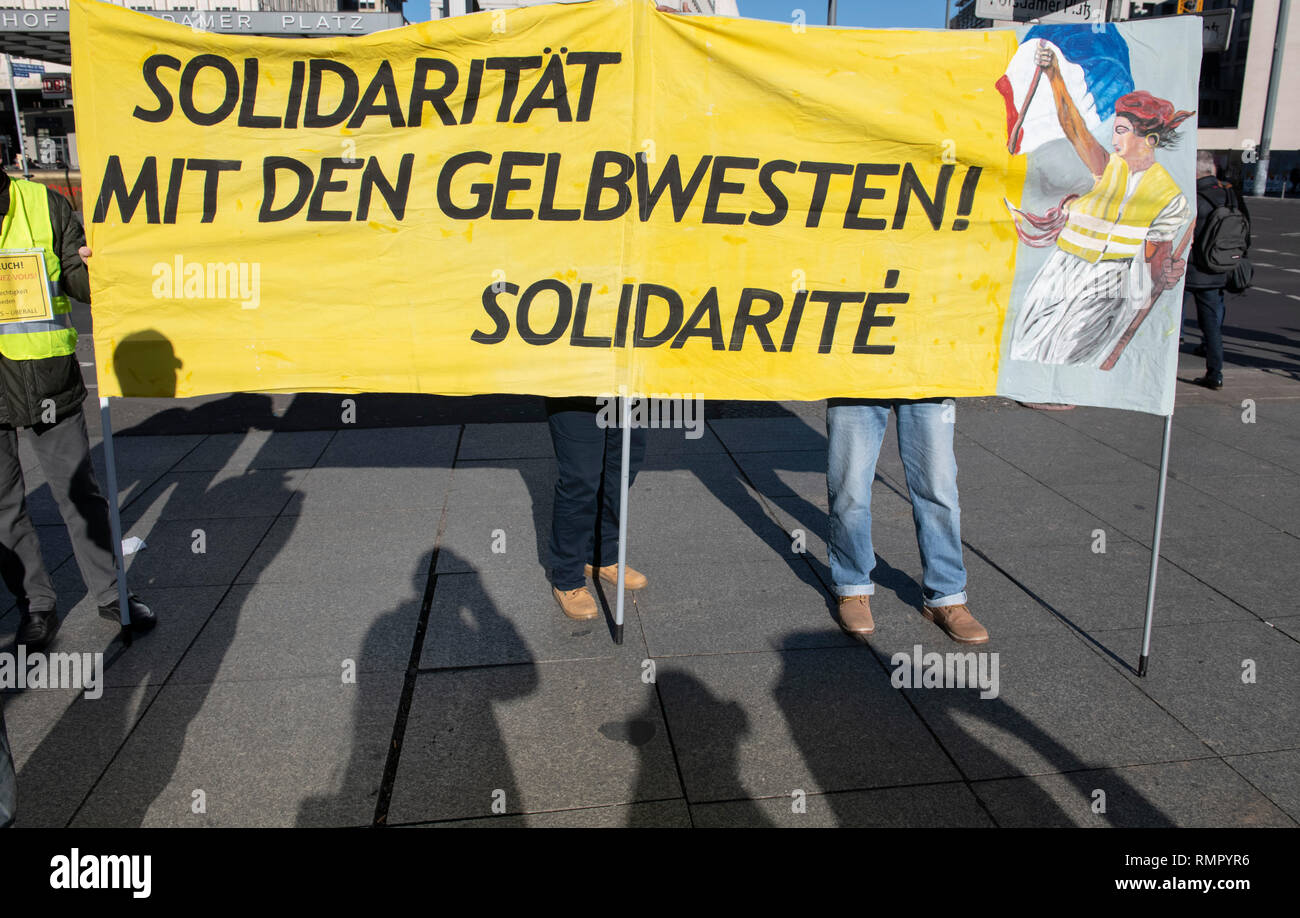 Bundesweit, Germany. 16th Feb, 2019. 'Solidarity with the Yellow Vests! Solidaritè' is on the banner of participants in the nationwide campaign day 'Bunte Westen'. Credit: Paul Zinken/dpa/Alamy Live News Credit: dpa picture alliance/Alamy Live News Stock Photo