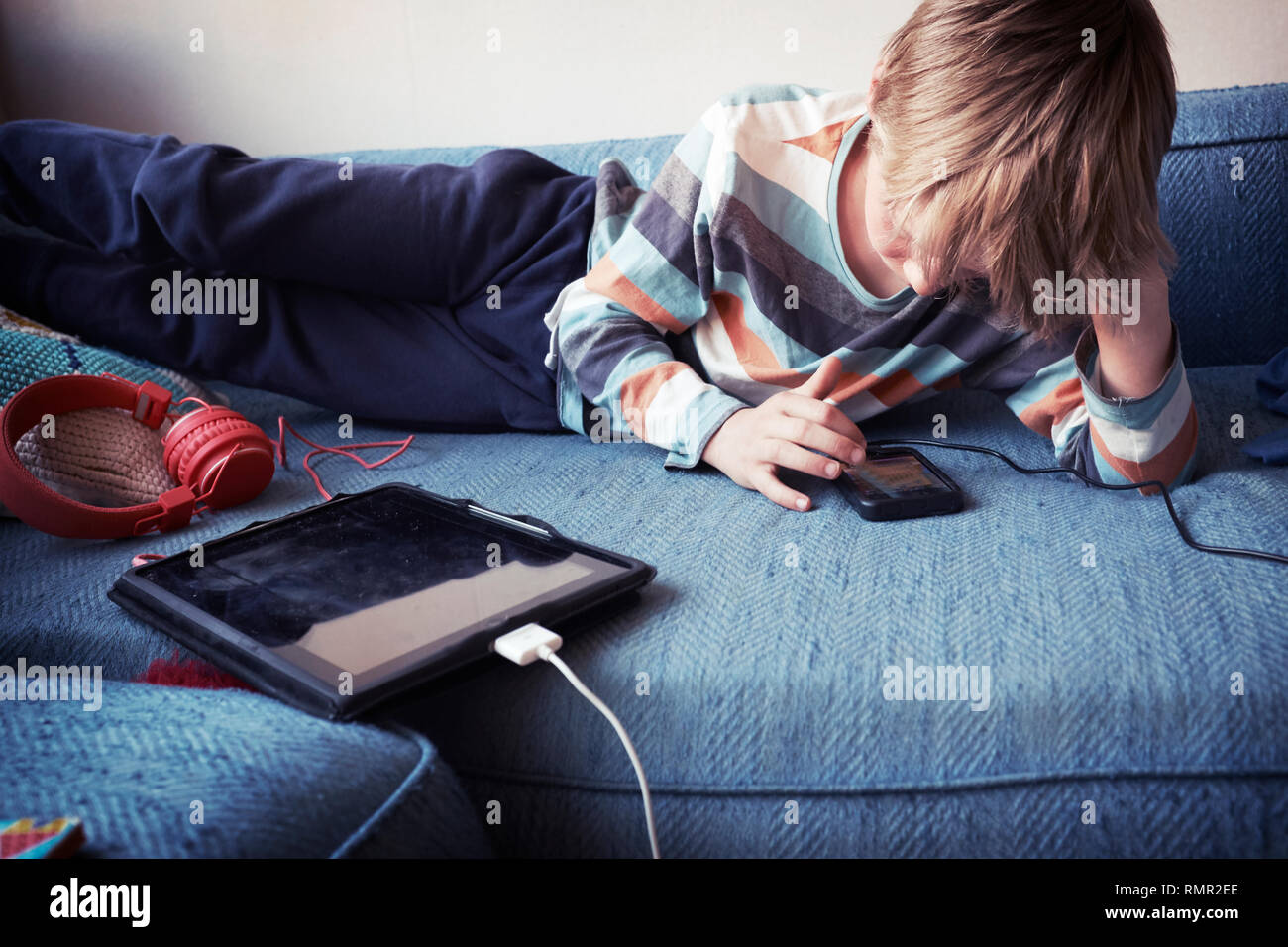 Boy using cell phone Stock Photo - Alamy