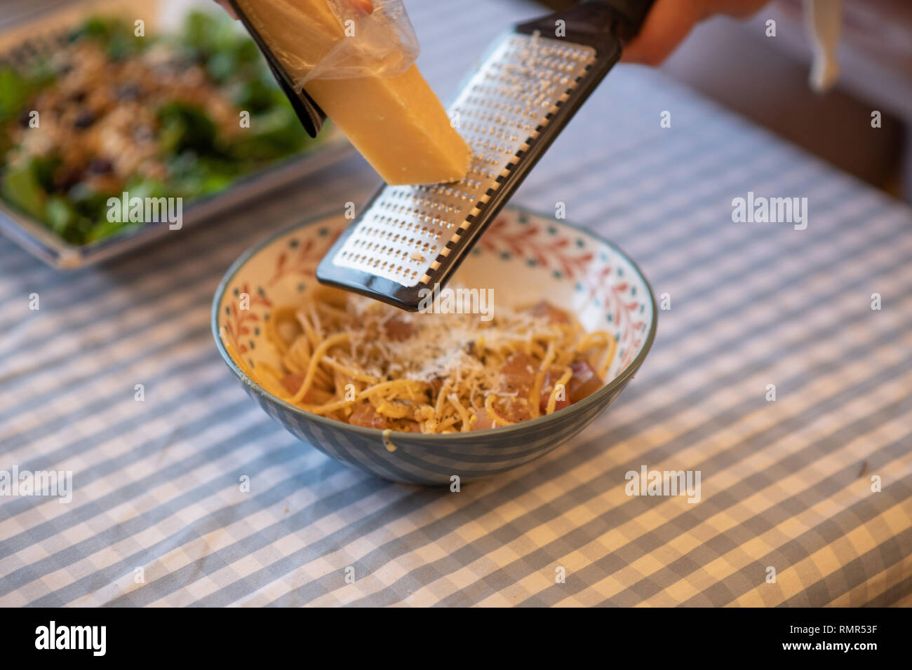 grinding parmesan cheese to carbonara Stock Photo Alamy