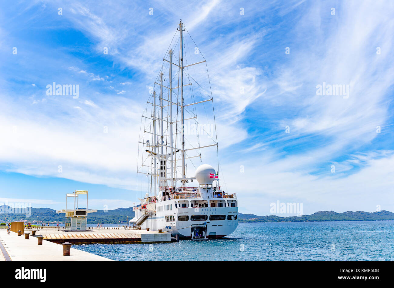 A large cruise sailing ship in the port on the embankment of the city of Zadar. Stock Photo