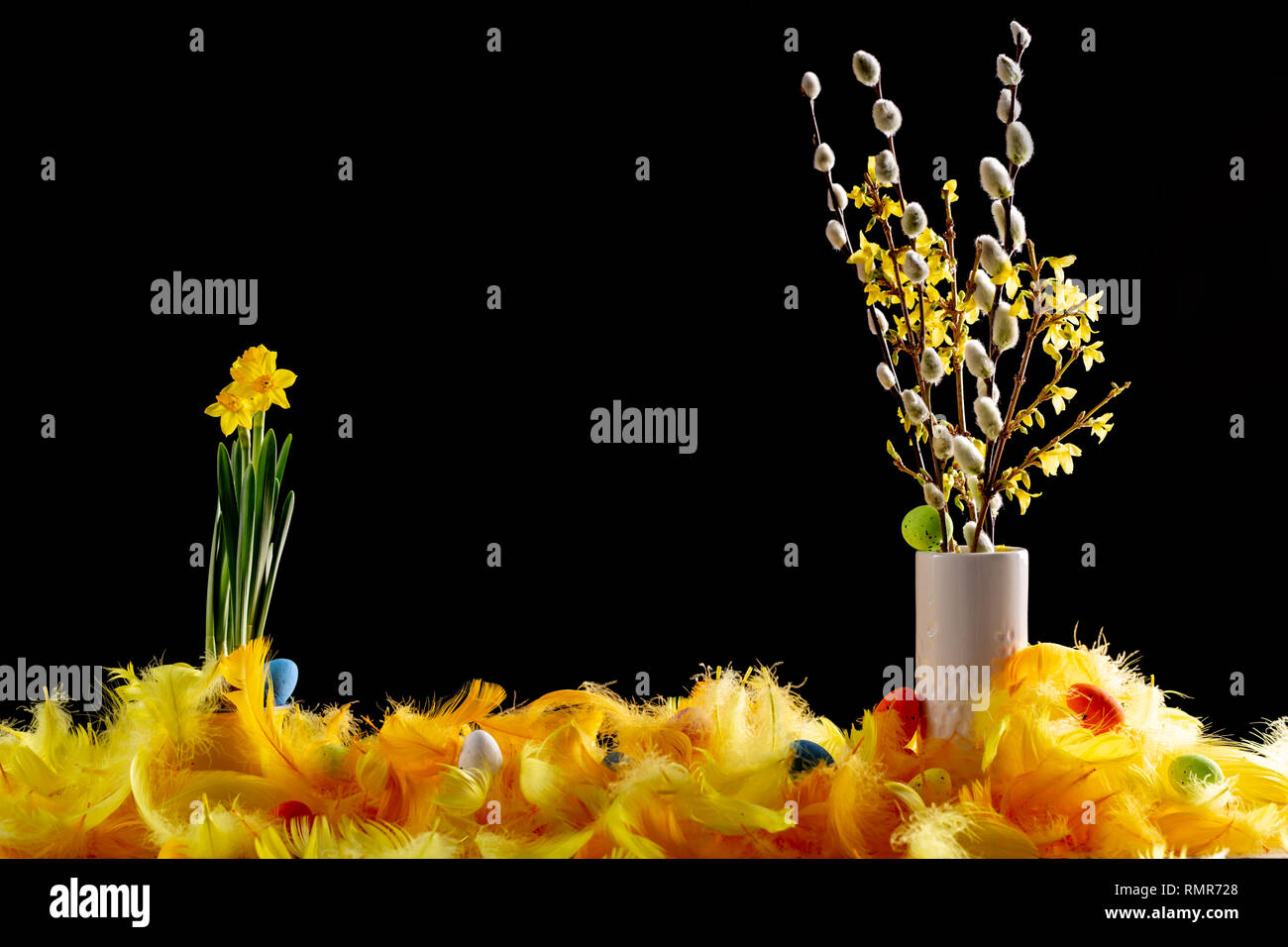 Dekoration with easter eggs and soft colour feathers. Stock Photo