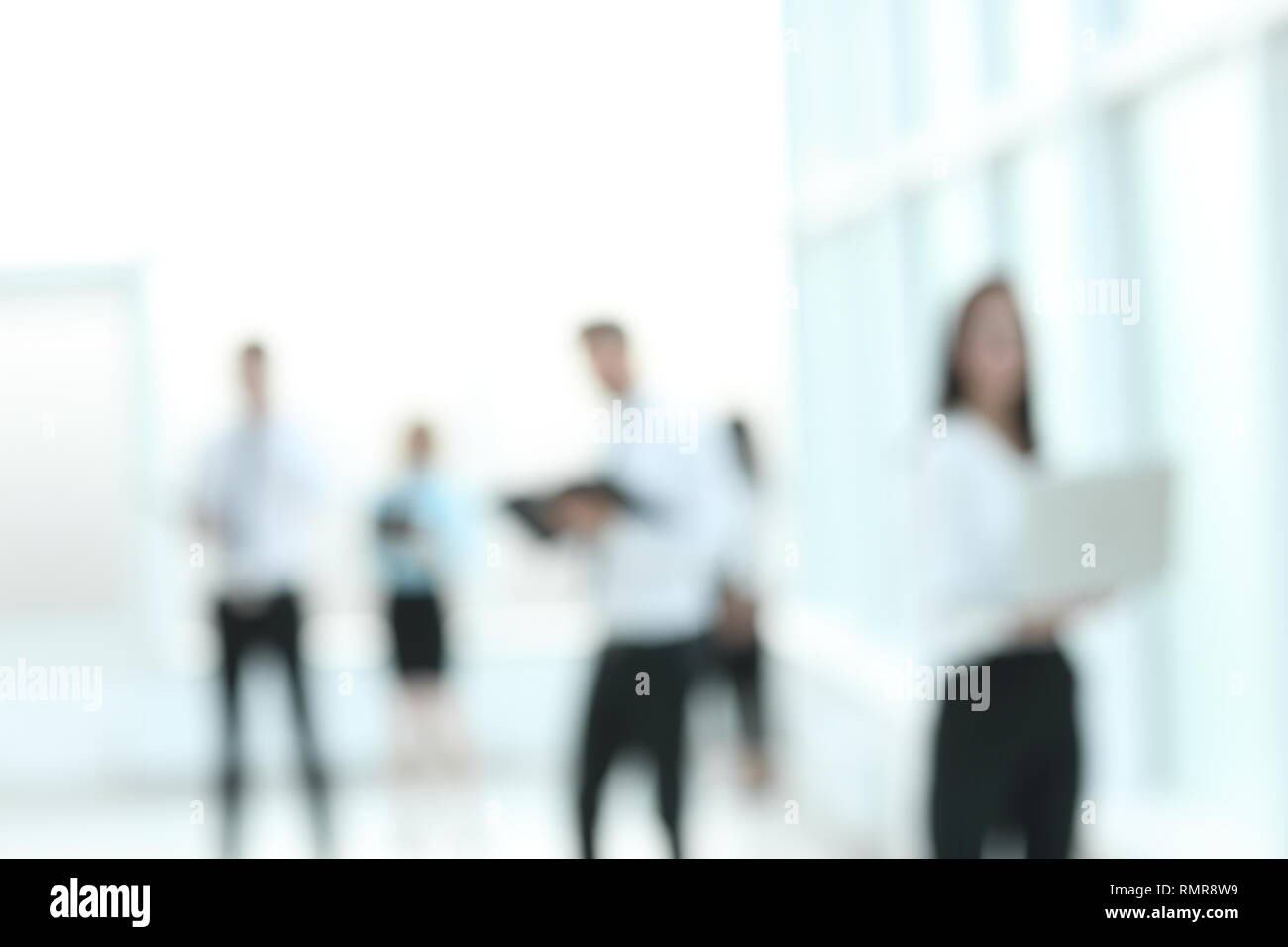 background image of employees standing in the office lobby Stock Photo Alamy