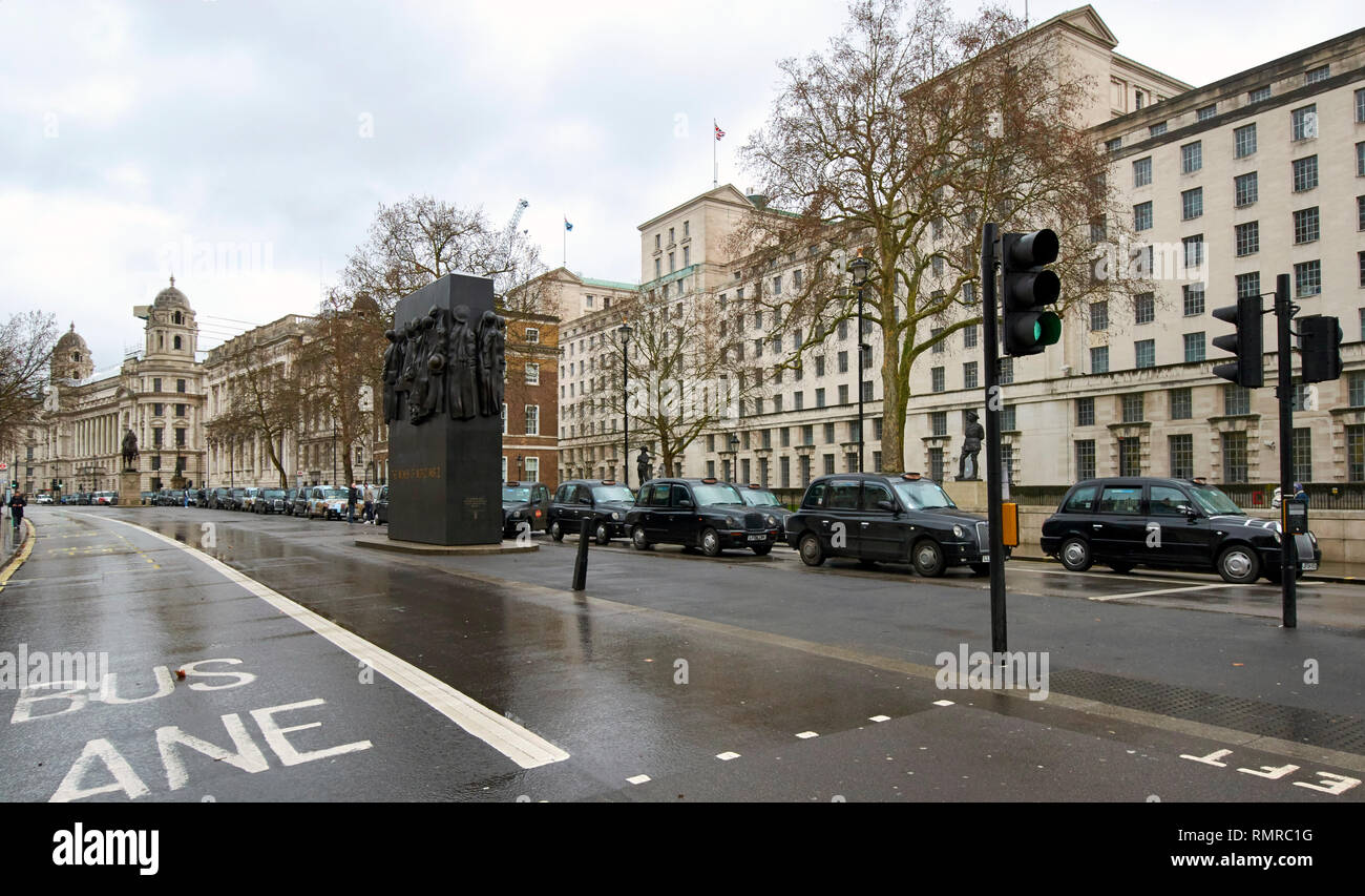 LONDON WHITEHALL NEAR TO MEMORIAL TO WOMEN OF WORLD WAR TWO A BLACK CAB TAXI DEMONSTRATION ON FEBRUARY 8 2019 A LONG LINE OF CARS Stock Photo