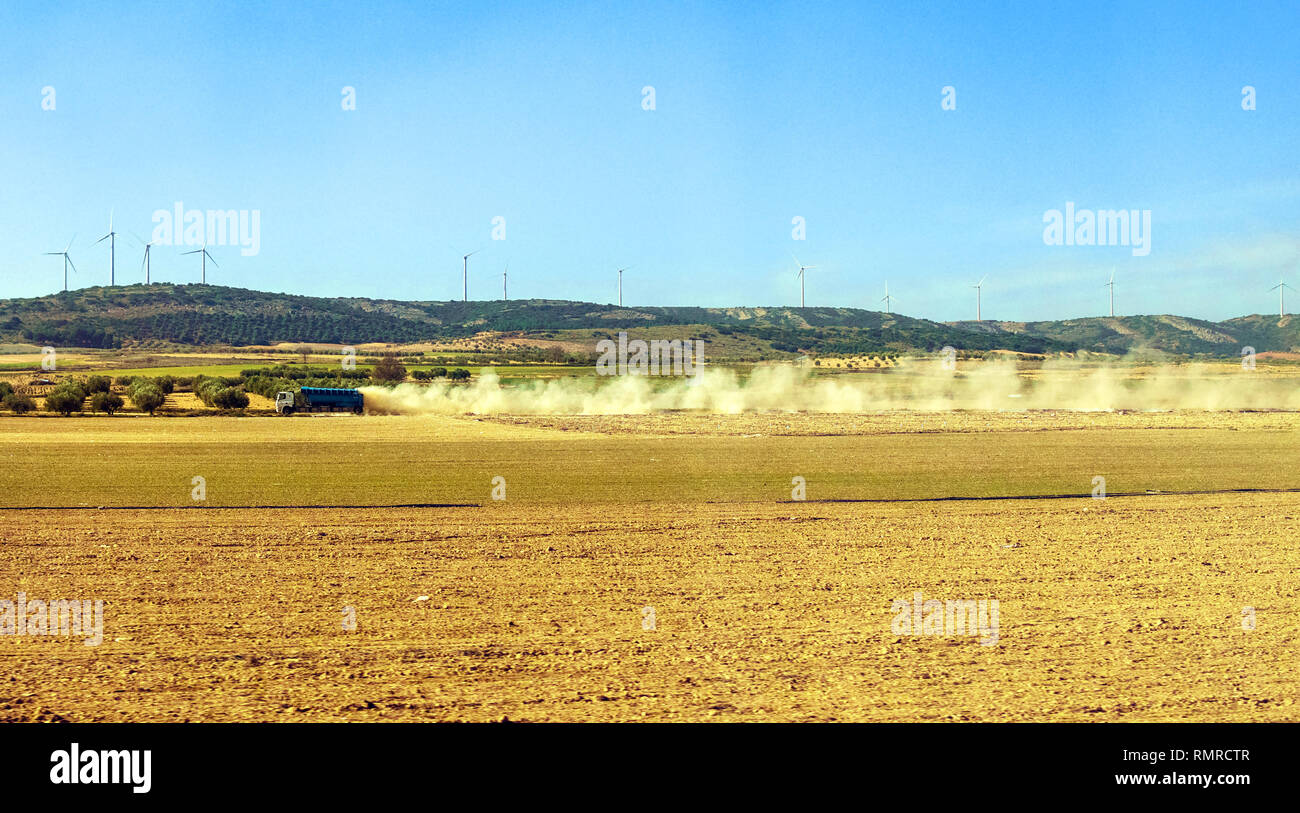 Spanish Truck Driving through dirt Roads and creating a cloud of dust Stock Photo Alamy