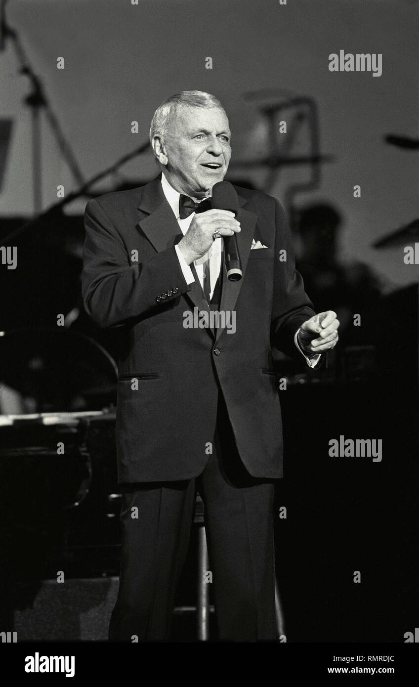 Singer & actor Frank Sinatra is shown performing on stage during a ...