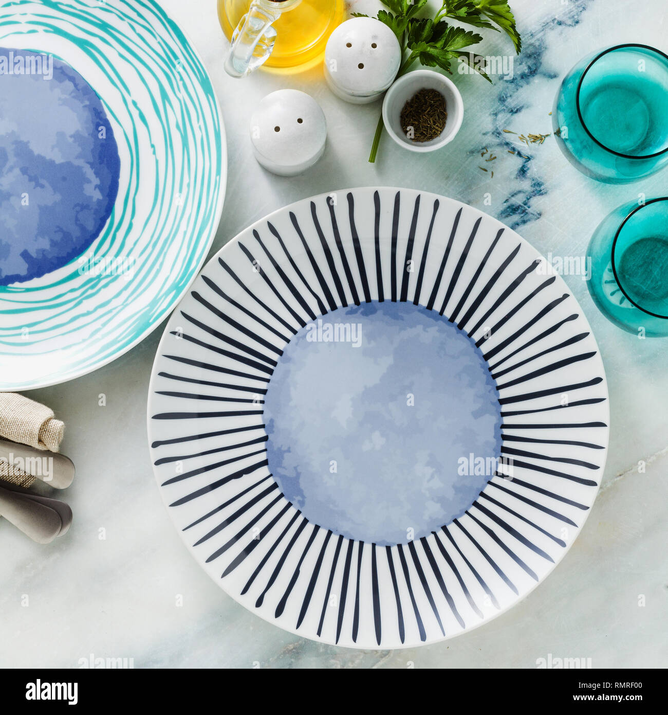 empty plates on the table, table setting for dinner or lunch. stylish kitchenware Stock Photo