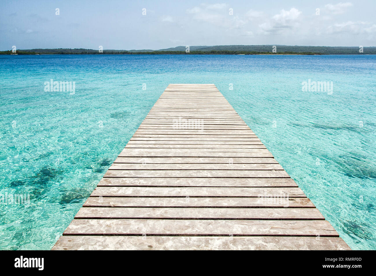Pier over turquoise clear water at Cayo Sombrero (Sombrero Island). Chichiriviche, Falcon State, Venezuela. Stock Photo