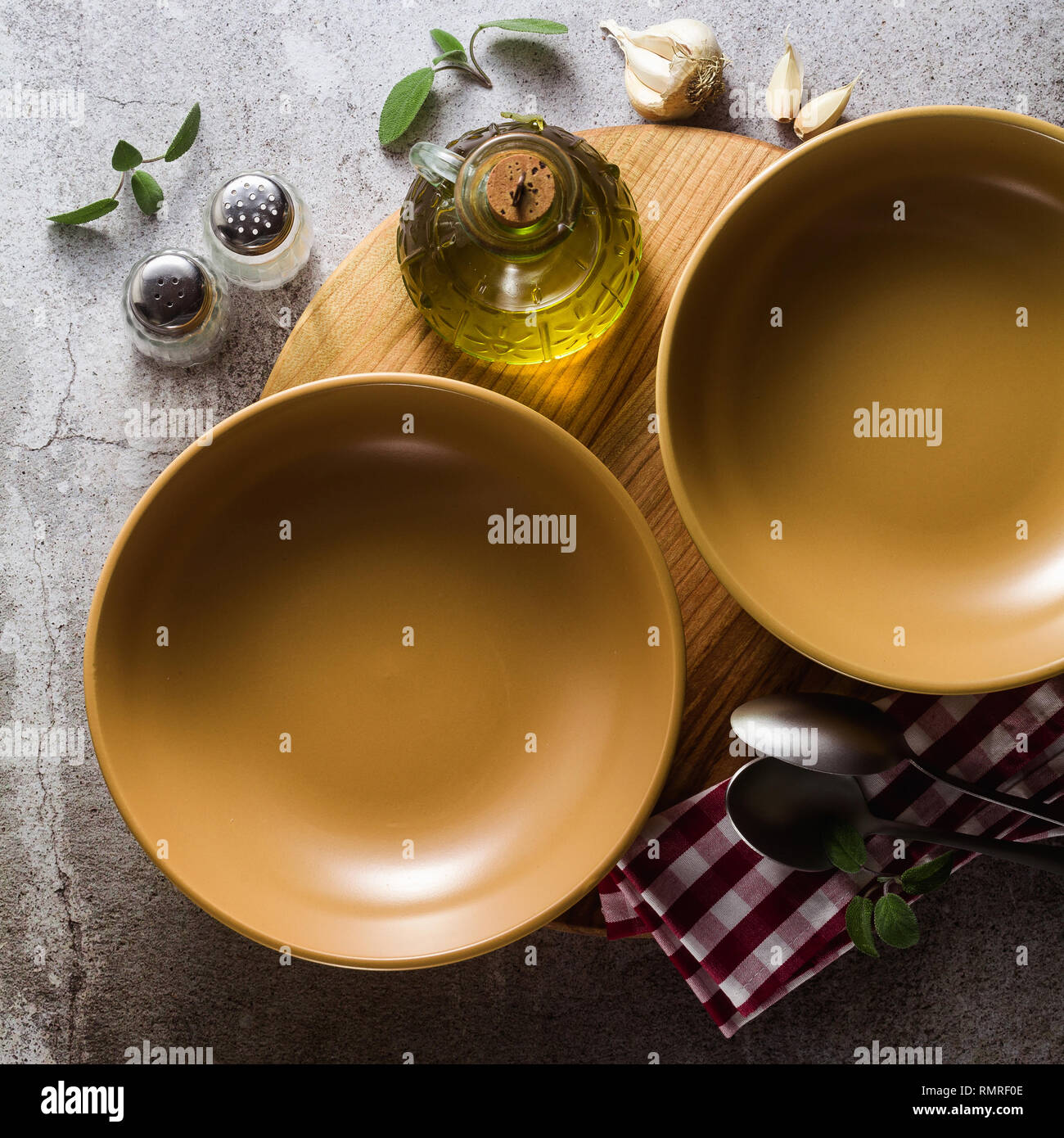 empty plates on the table, table setting for dinner or lunch. stylish kitchenware Stock Photo