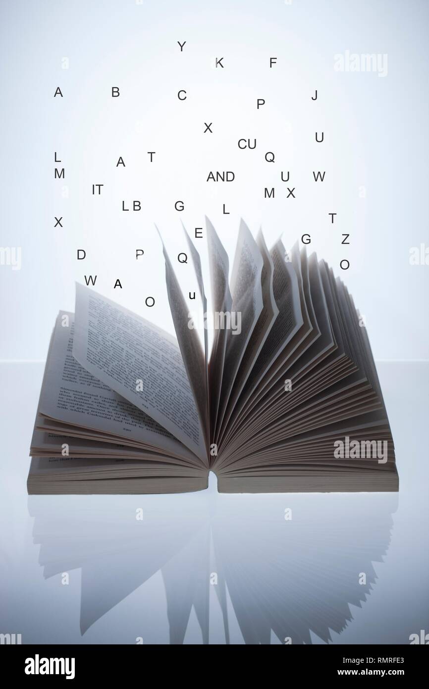 Open book with letters, conceptual image Stock Photo - Alamy