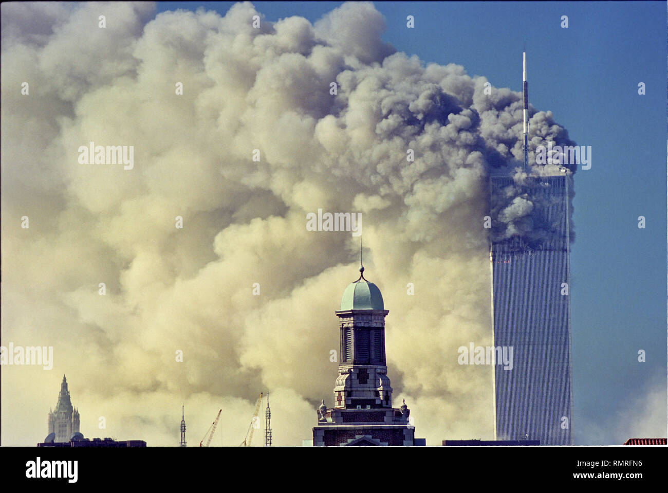 World Trade Center Attack photos taken from 14 street on a rooftop as the towers burn and one is falling. Stock Photo