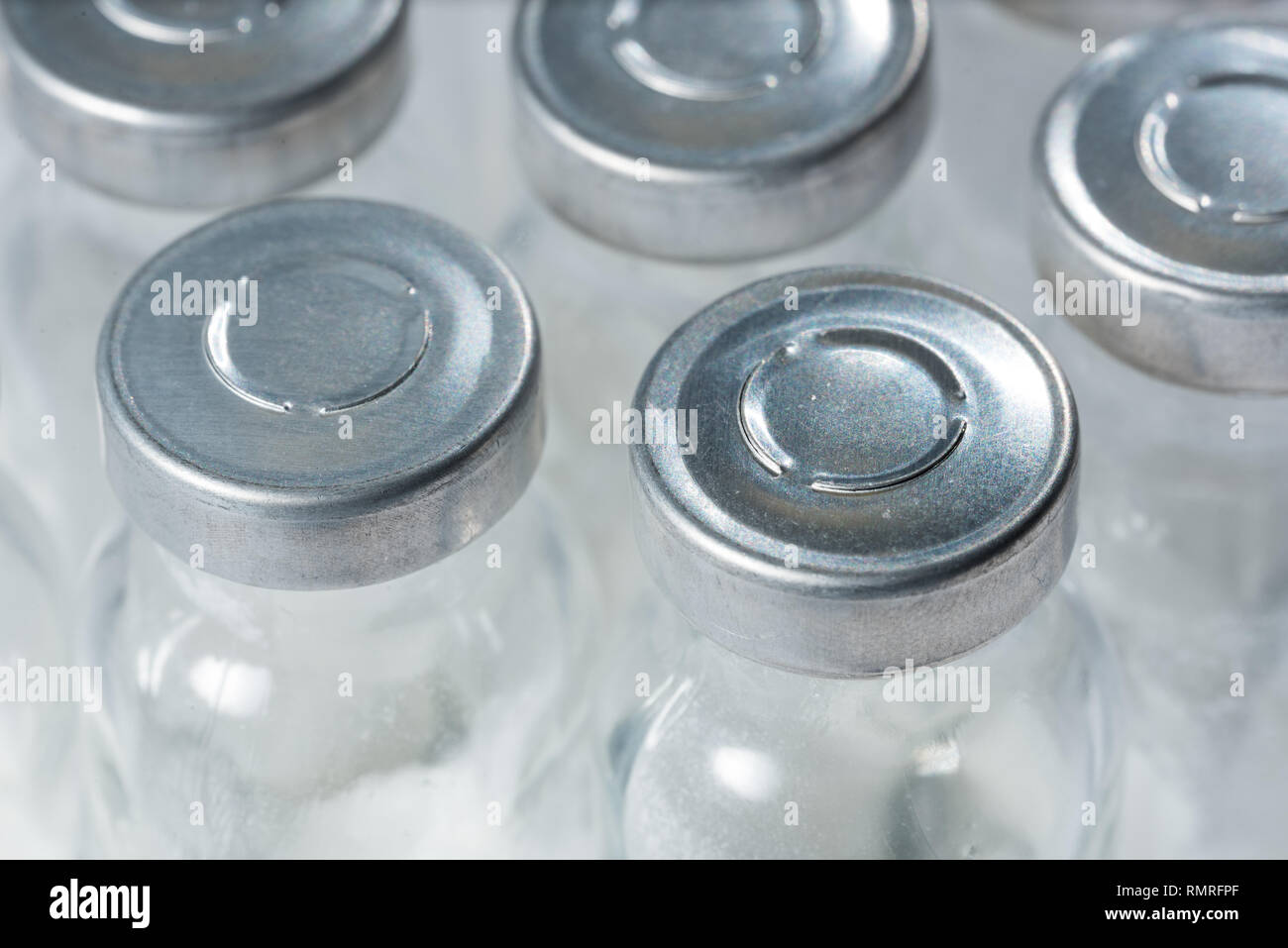 Bottles for injection with white powder close-up Stock Photo - Alamy