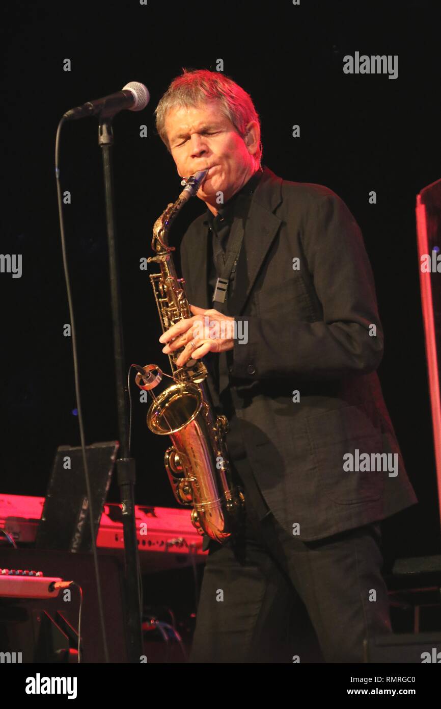 Saxophonist David Sanborn is shown performing on stage during a 