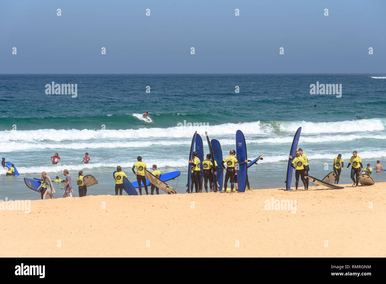 Students of the Manly Surf School lined up on the beach Stock Photo