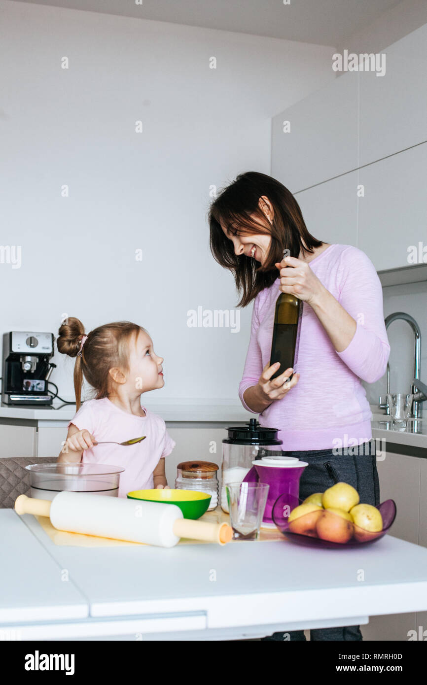 Family Time - Mother And Daughter Cooking Together Stock Photo