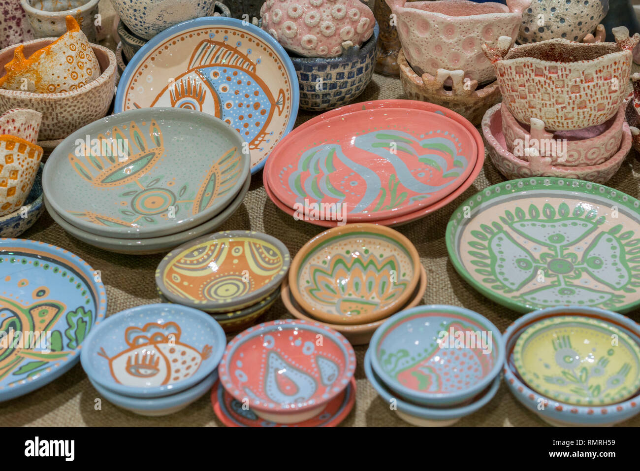 Variety of Colorfully Painted Ceramic Pots in an Outdoor Shopping Market.  pottery in the shop window Stock Photo - Alamy