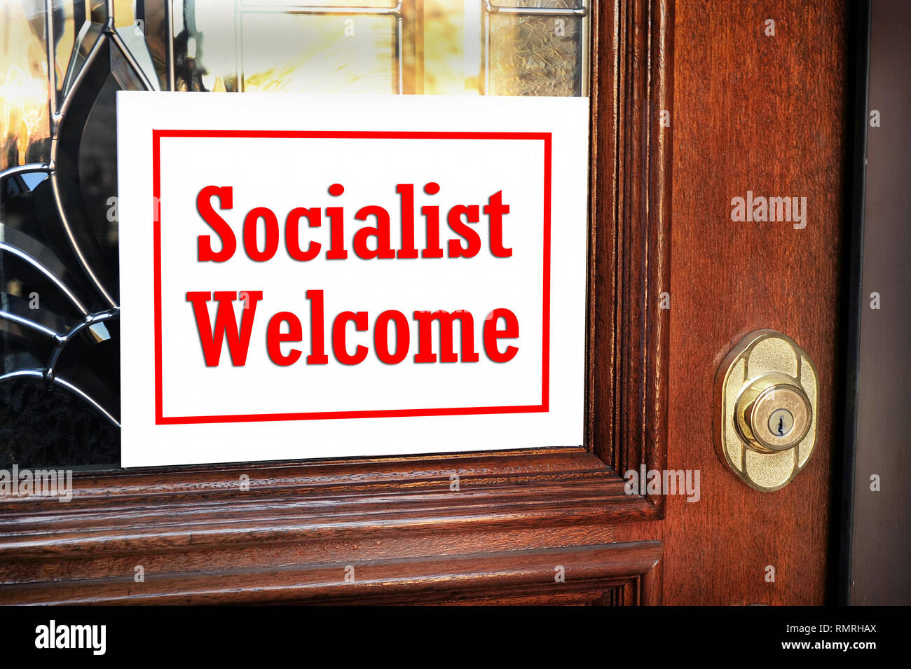 Socialist welcome sign on home front door. Stock Photo