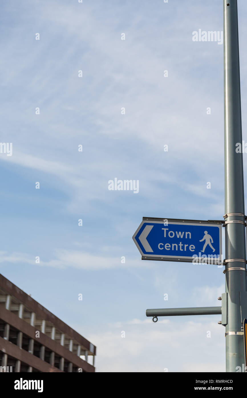A town centre sign pointing to the left Stock Photo