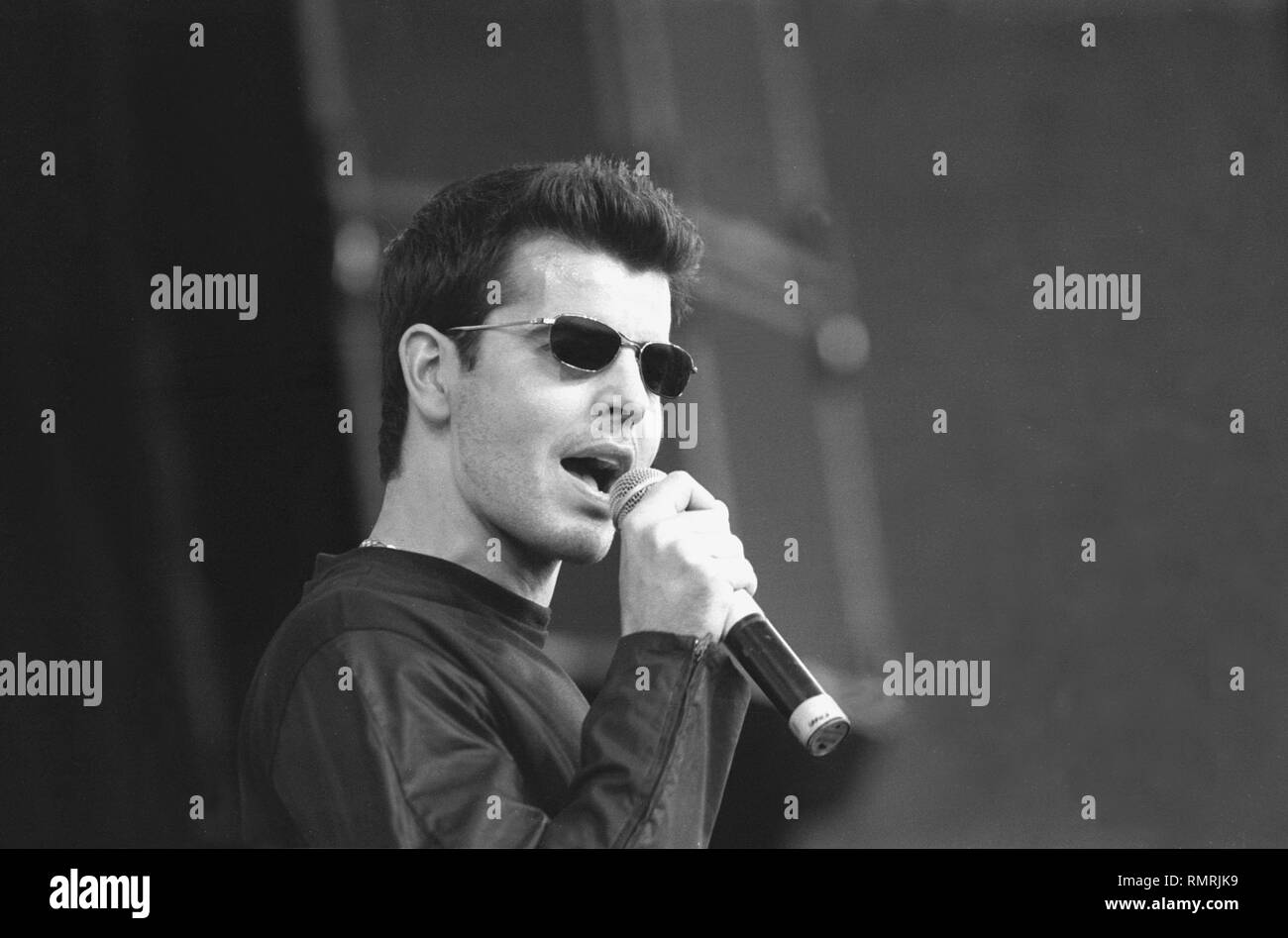Singer, songwriter and actor Jordan Knight, best known as a singer in the boy band, New Kids on the Block (NKOTB), is shown performing on stage during a concert appearance with his solo band. Stock Photo