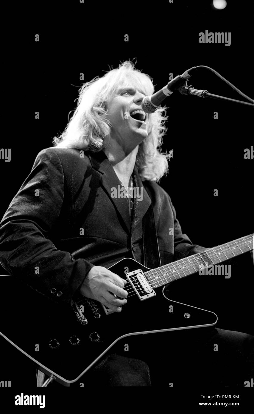 Singer, songwriter and guitarist Tommy Shaw of the rock band Styx is shown performing on stage during a 'live' concert appearance. Stock Photo