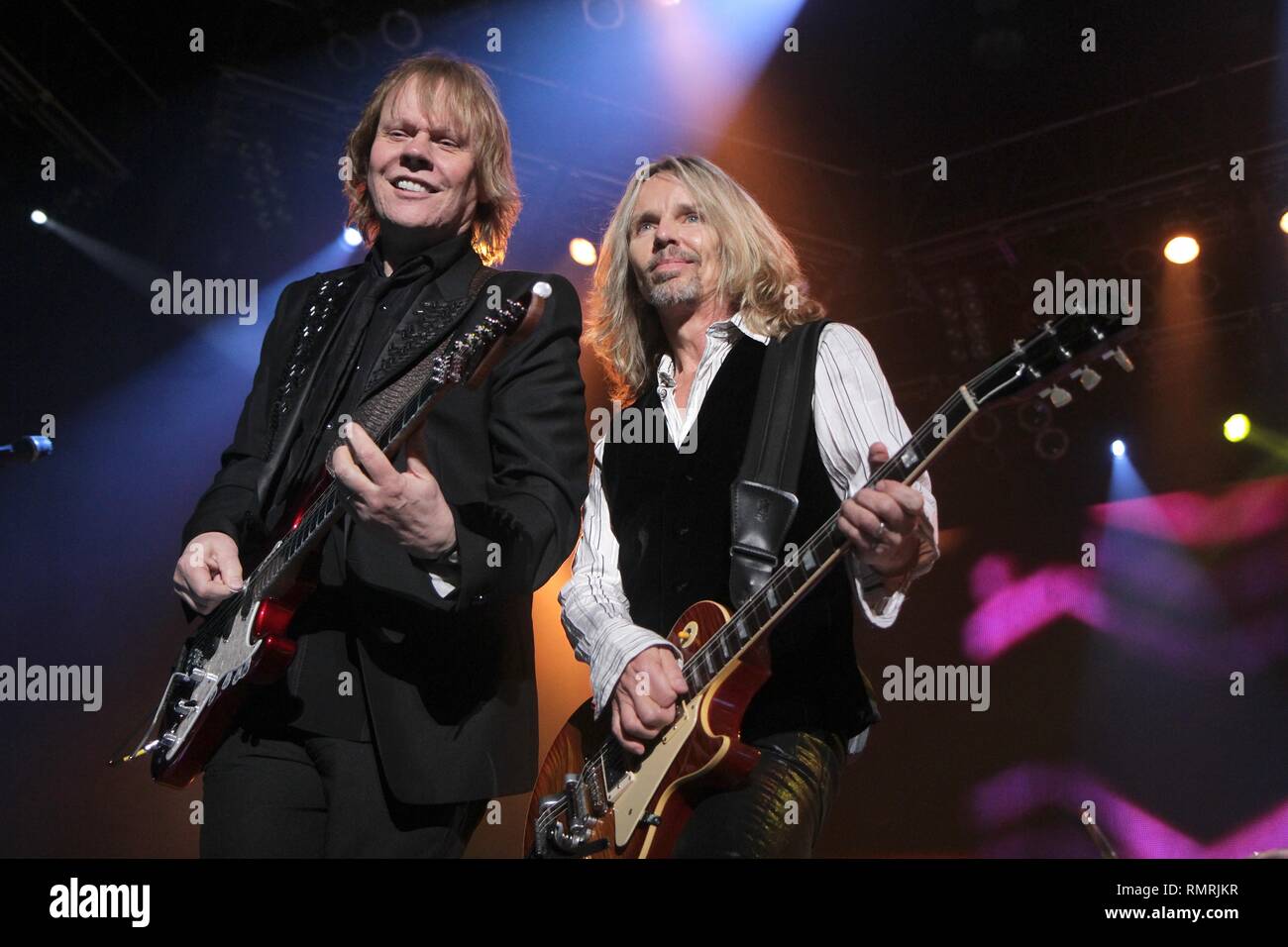 Musicians James Young and Tommy Shaw are shown performing on stage during a 'live' concert appearance with Styx. Stock Photo