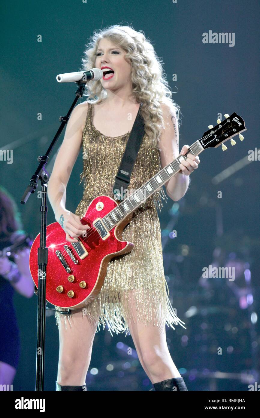 Singer, songwriter & guitarist Taylor Swift is shown performing on stage during a 'live' concert appearance. Stock Photo