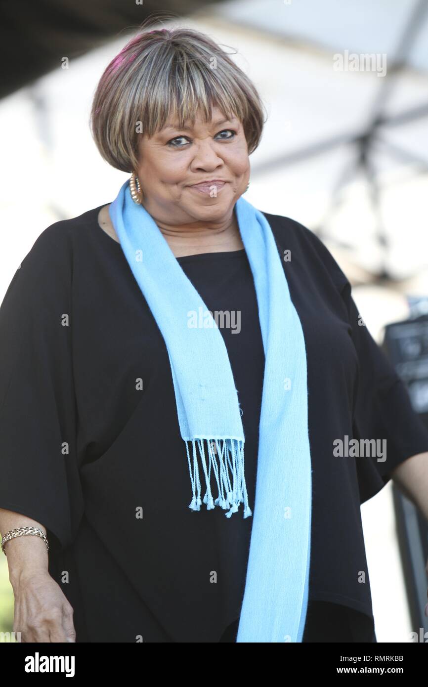 Rhythm & blues, gospel singer and civil rights activist Mavis Staples, who recorded with her family's band The Staple Singers, is shown performing on stage during  a 'live' concert appearance. Stock Photo