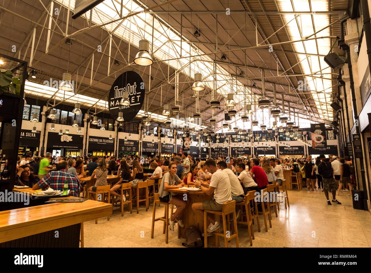 People enjoying eating at the newest and trendy food hall of Time Out Market, in downtown Lisbon, Portugal Stock Photo