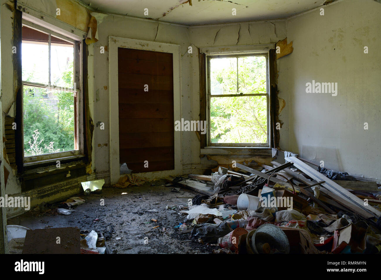 Abandoned Building - Trashed Front Room Filled with Detritus Stock Photo