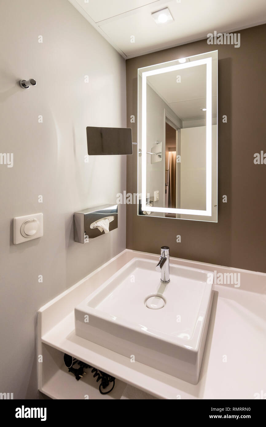Interior of a modern hotel bathroom with a mirror. Stock Photo