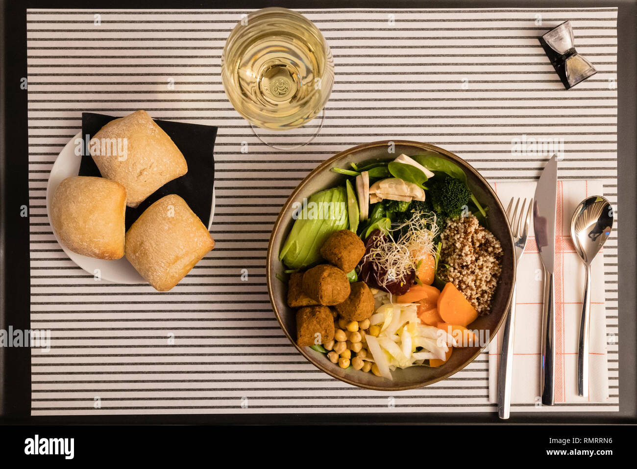 Hotel Room service: vegan meal and white wine. Stock Photo