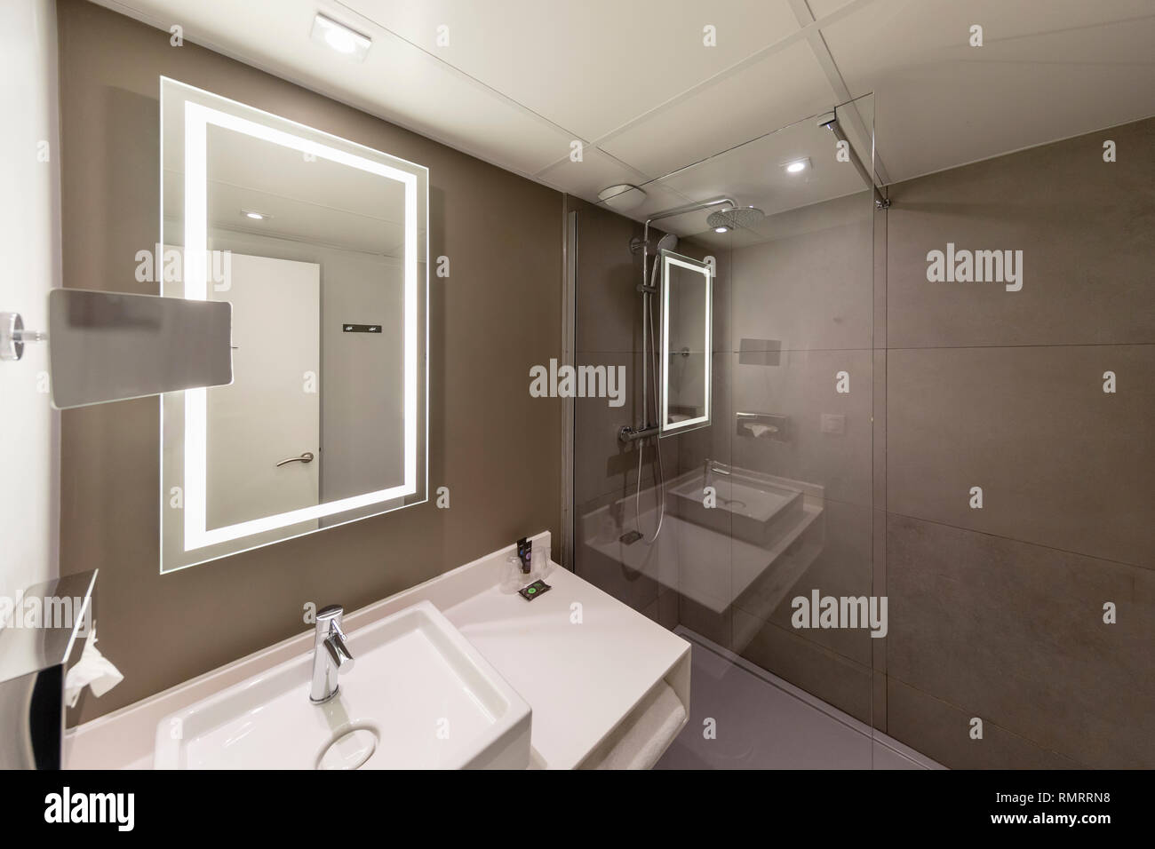 Interior of a modern hotel bathroom with a mirror Stock Photo - Alamy