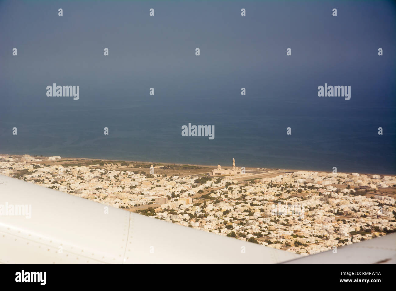 View from the plane of the city of Seeb and the mosque, near Muscat (Oman) Stock Photo