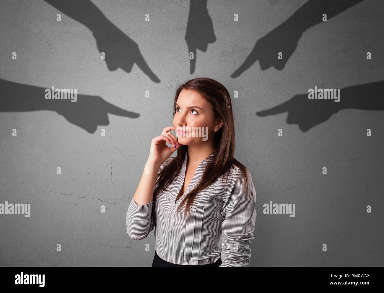 Young innocent  student with pointing hands concept  Stock Photo