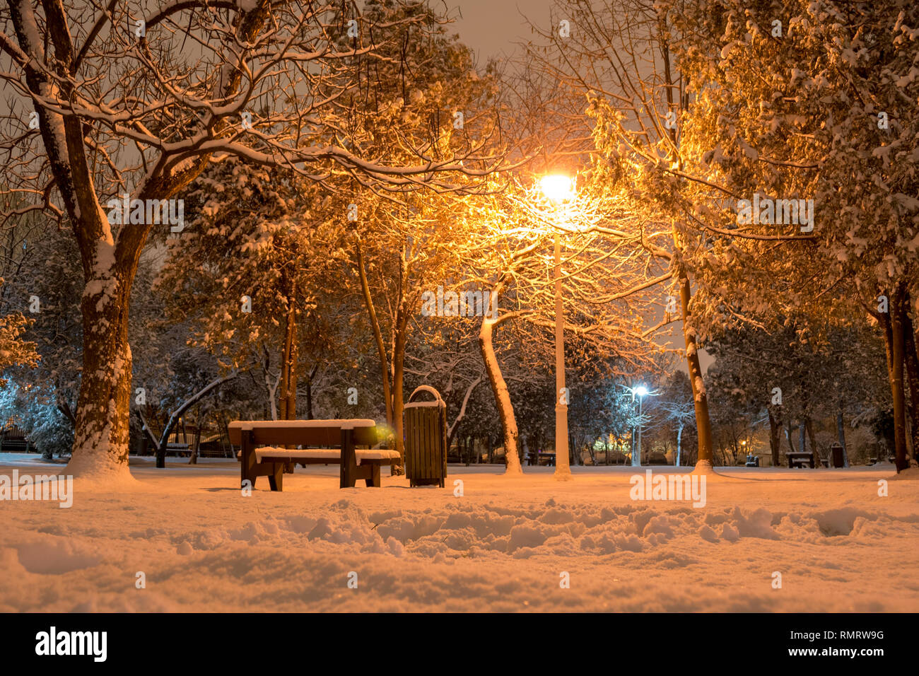 Scenic park view in Winter, with warm street light - Bucharest, Romania ...